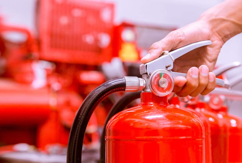 Close up Fire extinguisher and pulling pin on red tank. content-image